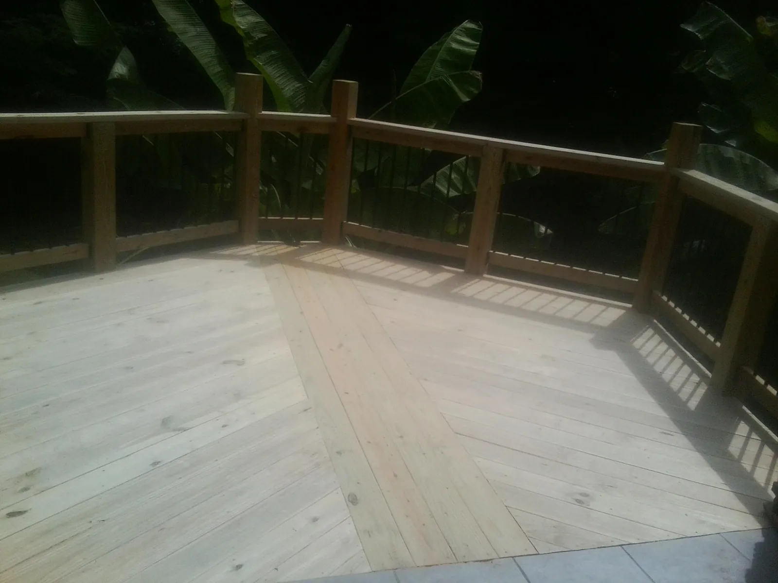 New wood deck and railing built off the back of a home in Lock Haven